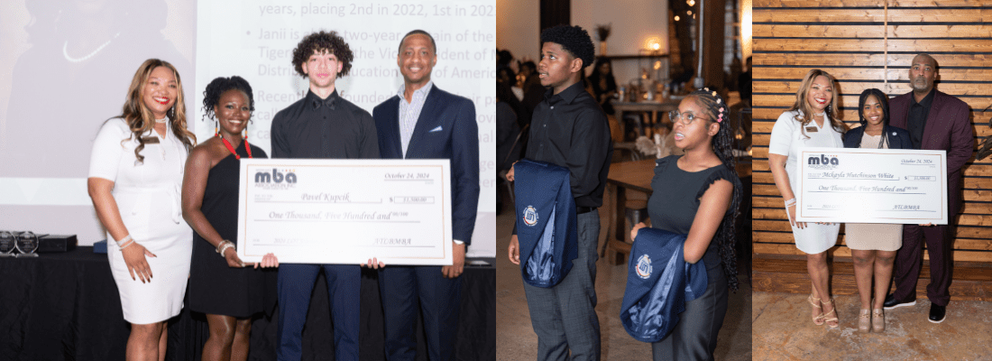 People holding large check at event.