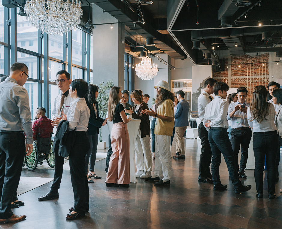 People networking at a social event indoors.