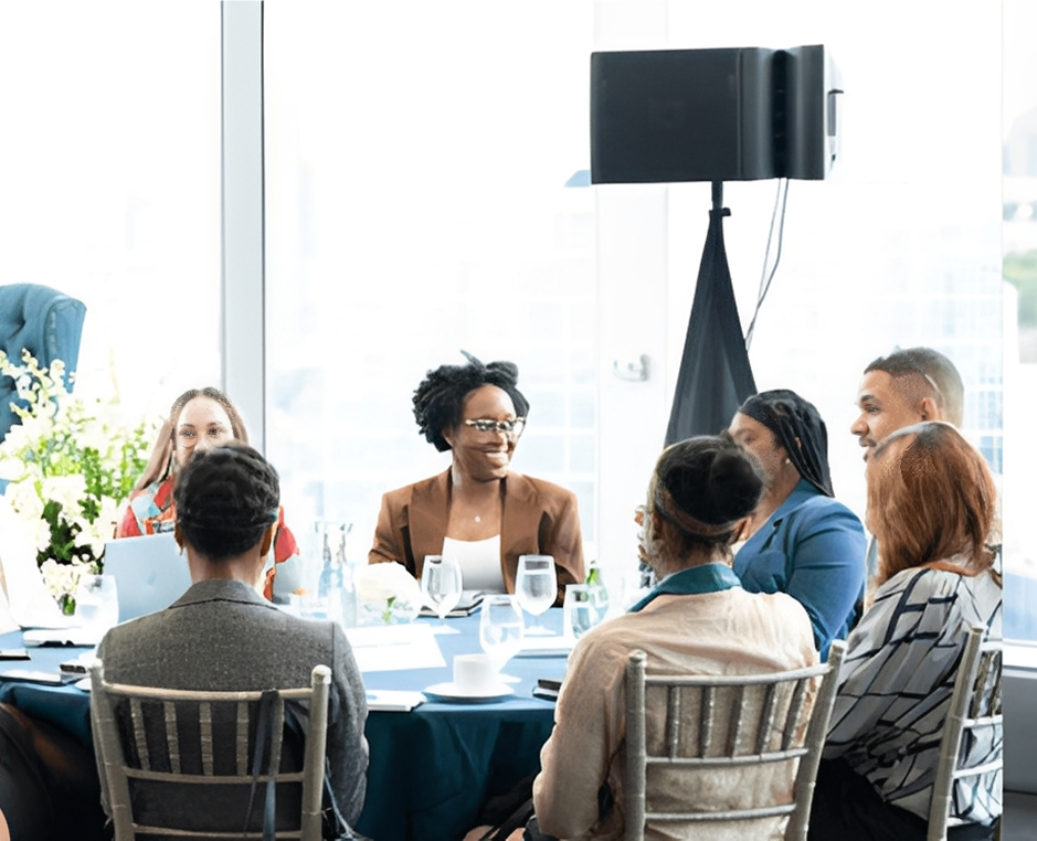 Group meeting around a conference table.